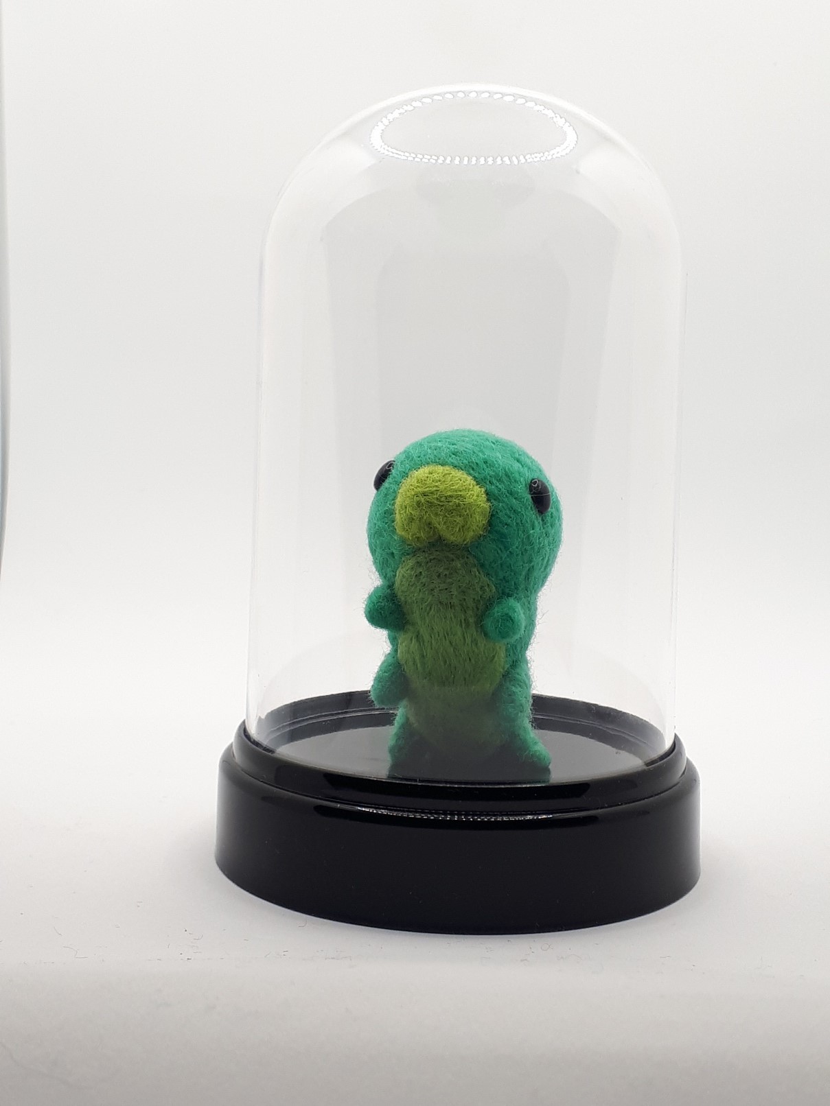 A green grub in a jar